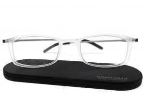 Gafas de lectura modelo Zaska en color hielo sobre su estuche de aluminio ultrafino Contour